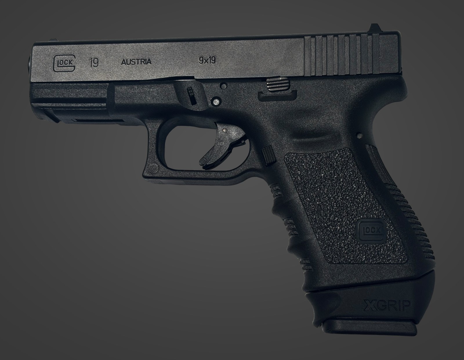 A GLOCK 19 with an XGRIP XGGL19-23 adapter fitted to a full-size magazine