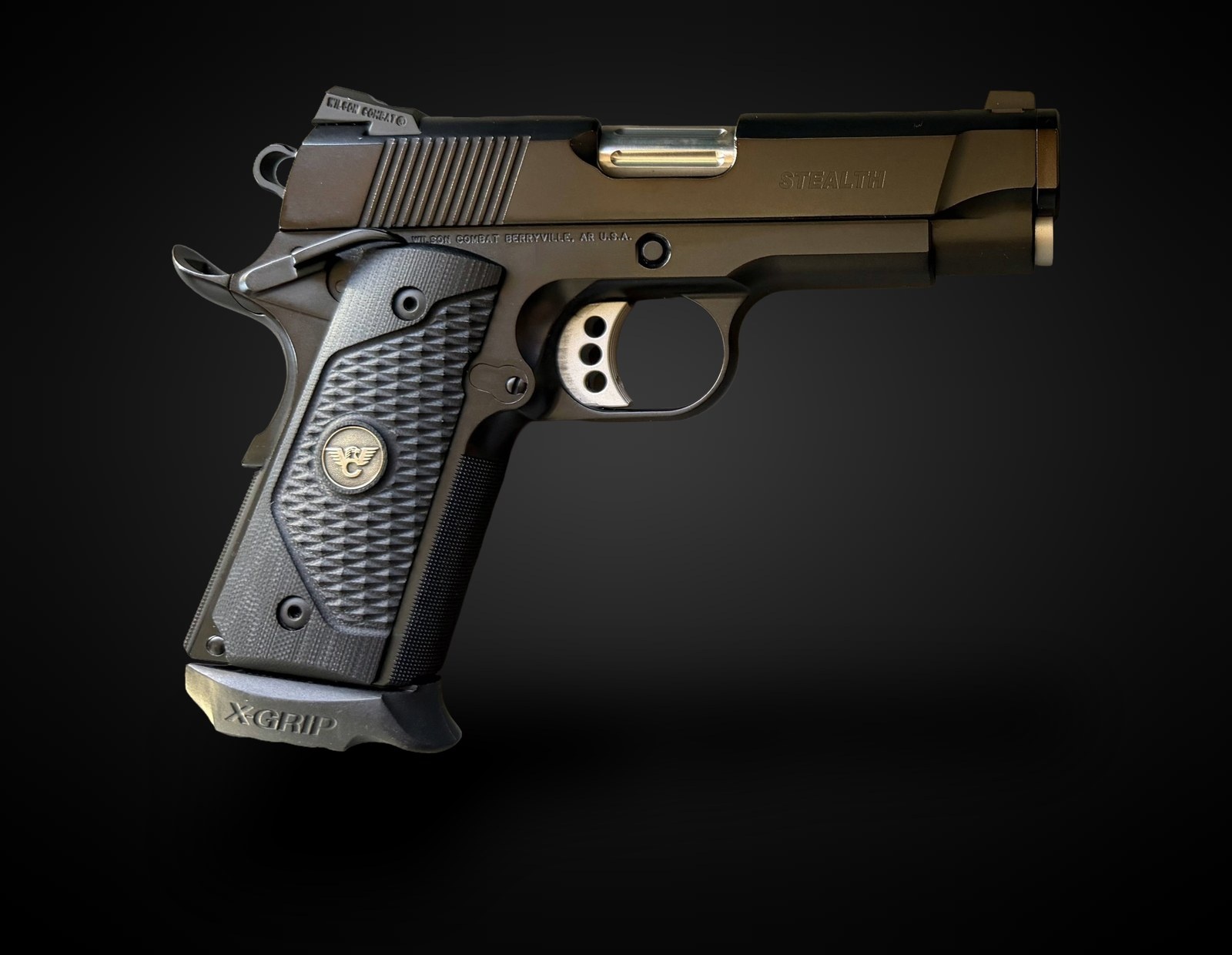 A 1911 Officers pistol with an XGRIP XG1911C1 adapter fitted to a full-size magazine
