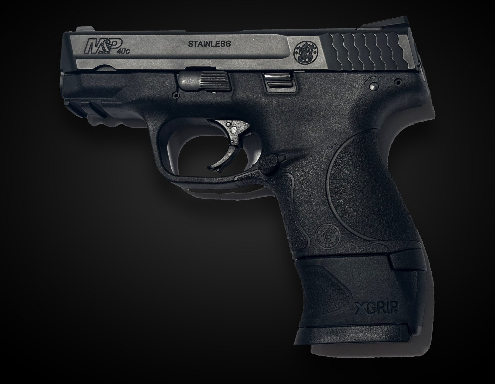 A Smith & Wesson M&P Compact with an XGRIP XGSWMP adapter fitted to a full-size magazine